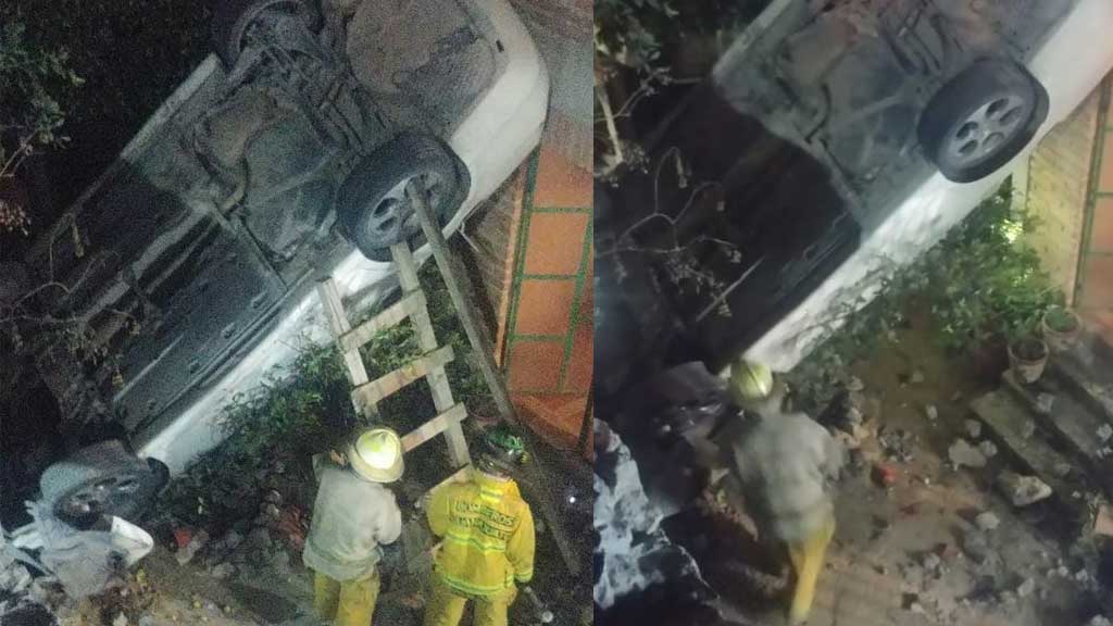 Carro vuelca sobre la Guanajuato-Dolores Hidalgo y cae en el patio de una casa